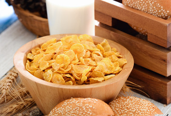 corn flakes in wood bowl