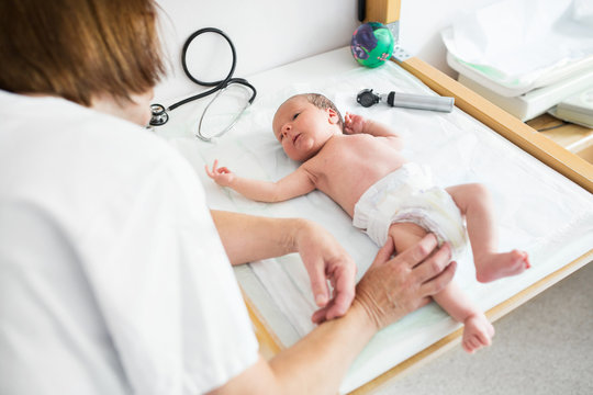 Baby (0-1 months) being examined by nurse