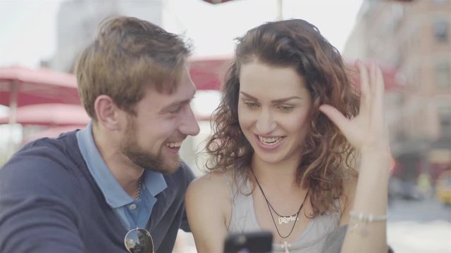 Couple looking at smart phone together
