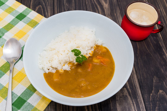 Japanese curry rice on vintage wooden table