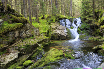 Idyllic waterfall in the carpathian mountains with clean water