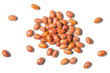 uncooked pinto beans on white, top view