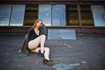 Sexy model girl wit long legs at black lingerie outfit body swimsuit combidress and jacket posed at...