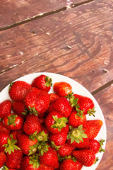 Strawberry at summer wood background