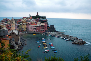 Fototapeta na wymiar Vernazza - colorful houses with a small harbor in the Cinque Terre region of Italy.