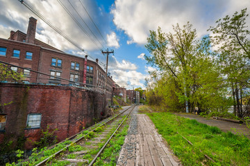Fototapeta na wymiar Railroad tracks and old buildings in Brattleboro, Vermont.