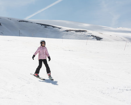 Beginner little girl learning to ski