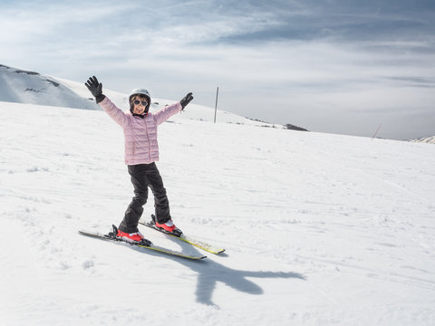 Beginner little girl learning to ski
