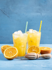 Glass of orange juice with ice cubes Cold orange fresh Glass of orange juice for hot summer day