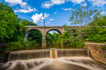 A dam on Wissahickon Creek and old railroad bridge, in Philadelphia, Pennsylvania.