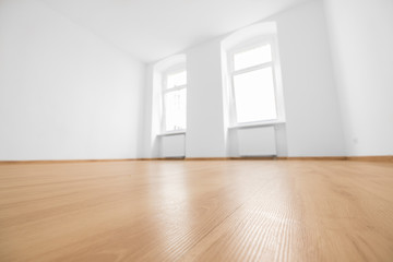 empty room, wooden floor in new apartment