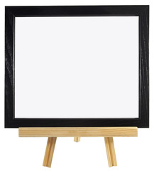 Blank black wood frame on presentation easel. Copy space. Isolated. Horizontal.
