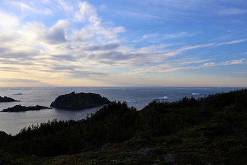 blueish sunset and a ocean with drift ice © ajkramer