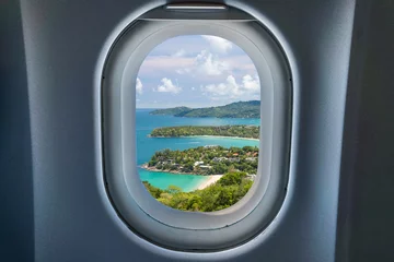 Zelfklevend Fotobehang Beautiful turquoise ocean waves with boats and coastline from high view point, view from window airplane. Kata and Karon beaches Phuket Thailand © powerbeephoto