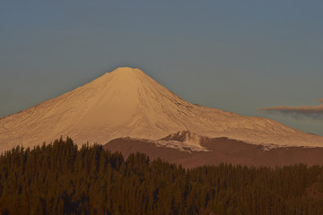 Fototapeta na wymiar Snow capped peak of Antuco Volcano (2,979 metres) in Laguna de Laja National Park in the Bio Bio region of Chile.