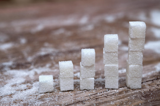 Stacks of white sugar cubes &ndash; diabetes and high blood sugar risk concept