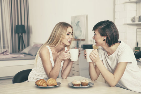 Morning of young lesbian couple at home