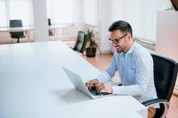 Entrepreneur working with a laptop in office