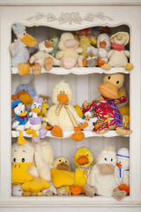 Family of plush geese on vacation. Children's soft geese toys. Toy geese