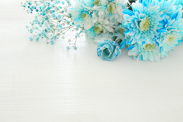 Top view of beautiful and delicate blue flowers arrangement