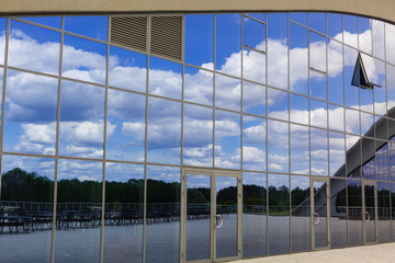 modern blue glass wall of skyscraper