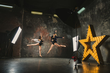 Photostudio. Girls posing for a photographer