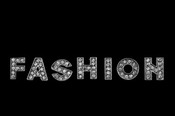 Obraz premium FASHION / FASHION. View of alphabet jewel on black background.
