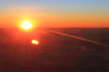 Fototapeta na wymiar Beautiful sunrise cloud sky, view on airplane