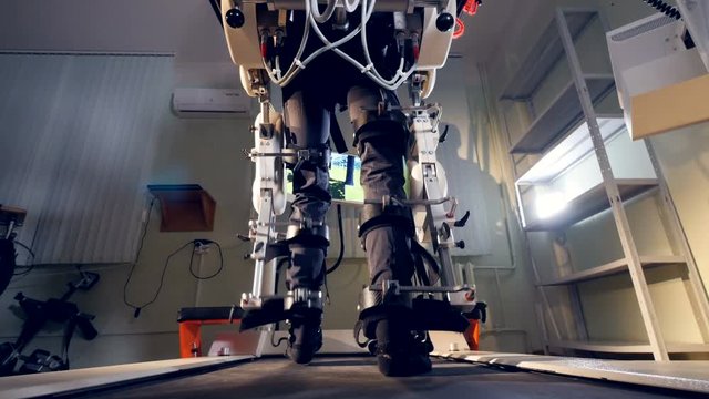 A person during training therapy with robotic support.