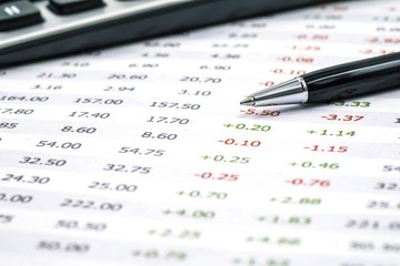 Accounting and finances with pen and calculator