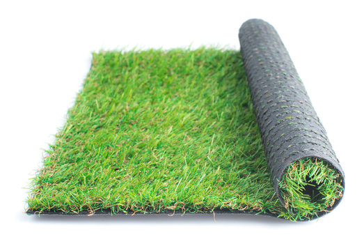 Patch Of Green Artificial Grass On A White Background