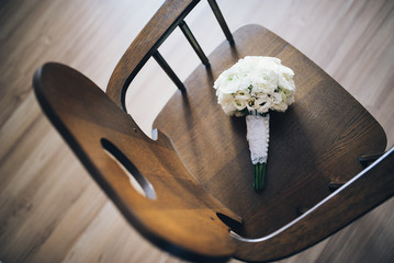 beautiful modern wedding bouquet on chair background