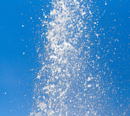 Splashing water against the blue sky