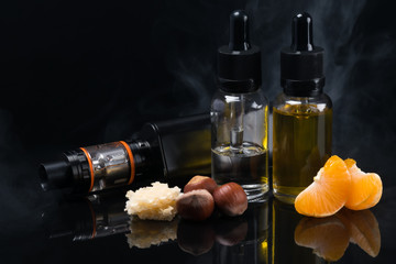 Electronic cigarette with different flavors in bottles with reflection on a black background