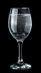 glass of sparkling water over dark background