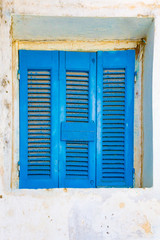 Fototapeta na wymiar Closed blue window shutters