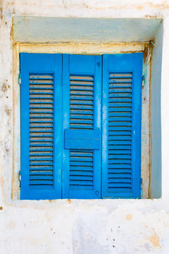 Closed blue window shutters