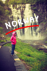 Tourist woman by Skjervsfossen Waterfall - Norway