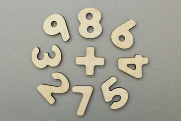 A study of figures for children on a gray background.