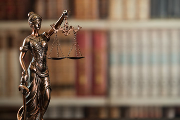 Lady Justice and law books in court - 158218243