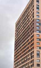 Fototapeta na wymiar Fragment of modern residential building.