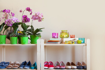 Rows of colorful women's shoes (ballet shoes) in the wardrobe. Selective focus