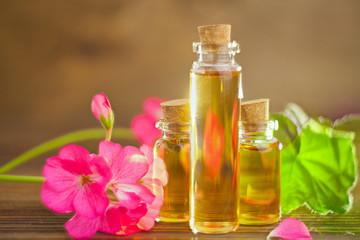 Essence of flowers on table in beautiful glass jar