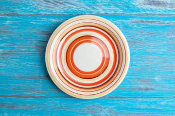 Striped plate on wood background