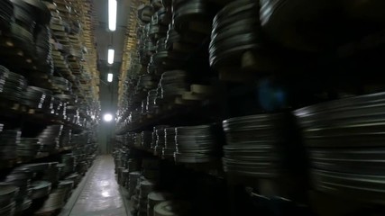 Numerous videotapes being stored in film archive.