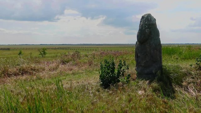 Stone statue on the background of the sky and the Ukrainian steppe, Askania-Nova.