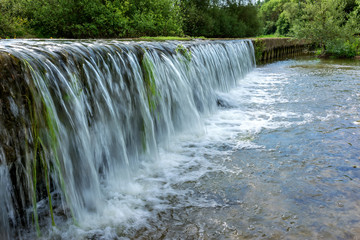 French countryside. A small waterfall on the banks of the Meuse in the south of Lorraine
