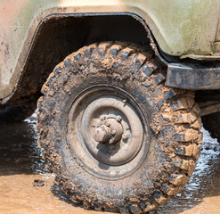 Dirty wheel of an off-road car after driving in the rain © Alexandr Blinov