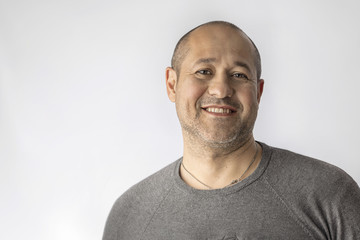 Fototapeta premium Portrait of a friendly man on a white background