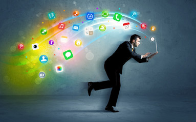 Fototapeta na wymiar Running businessman with application icons from device